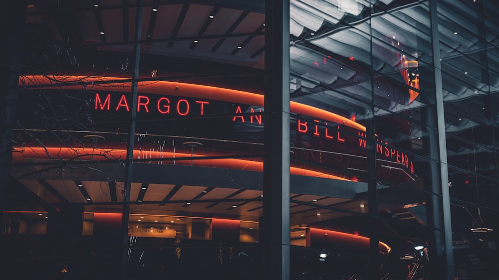 the margot an bill in london sign is lit up at night