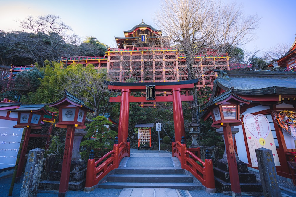 a large red gate with steps leading up to it