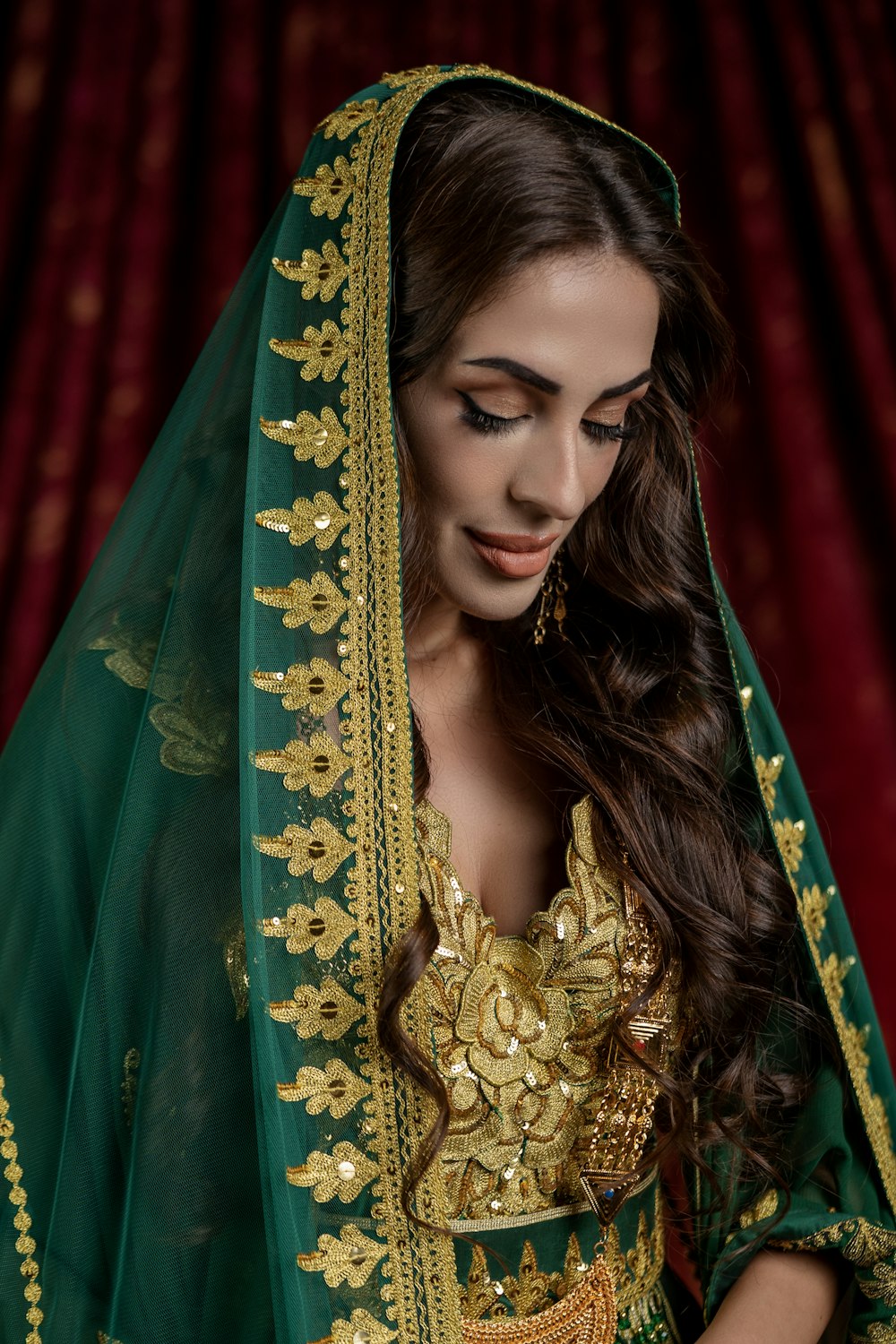 a woman in a green and gold outfit