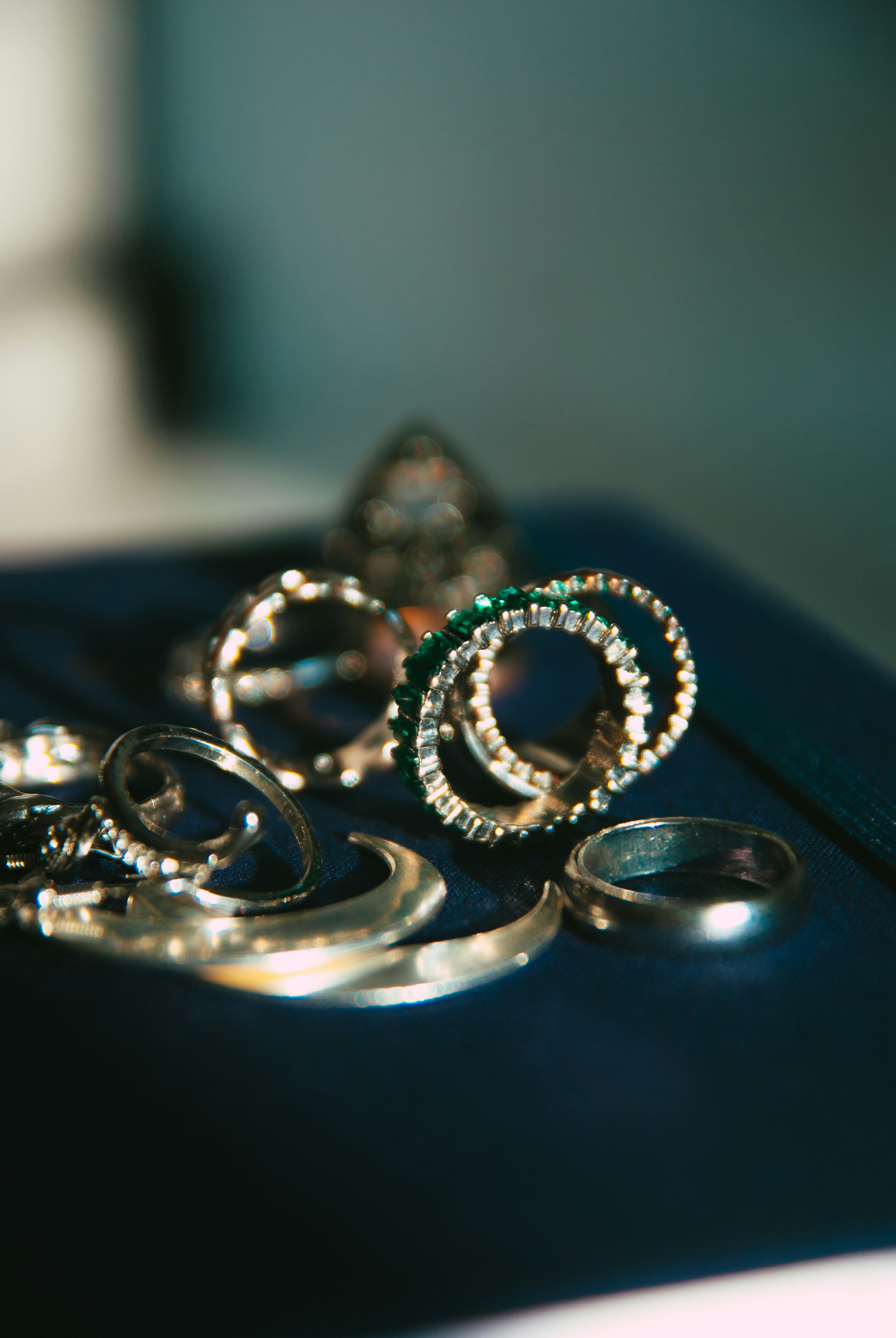 a couple of rings sitting on top of a piece of luggage
