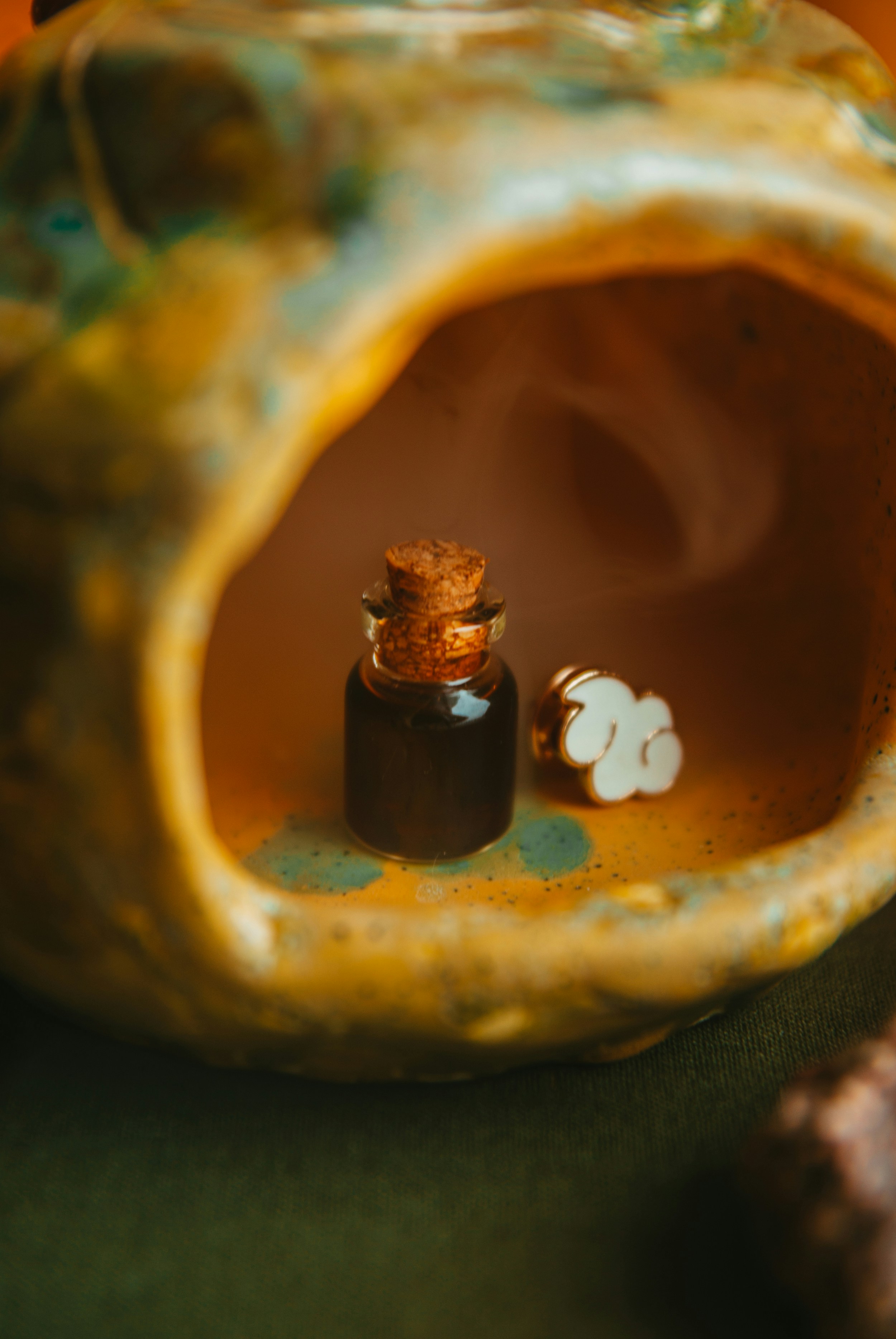 a bottle of essential oil sitting on top of a table