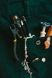 a pocket full of assorted items including a pair of scissors