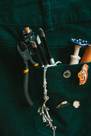 a pocket full of assorted items including a pair of scissors