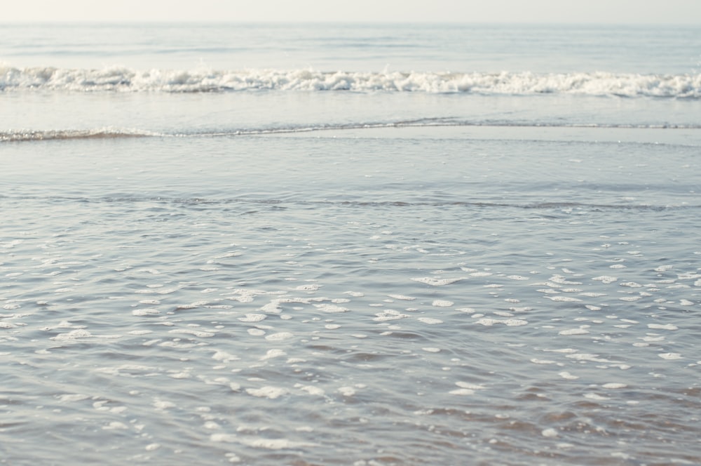 a person riding a surf board on a body of water