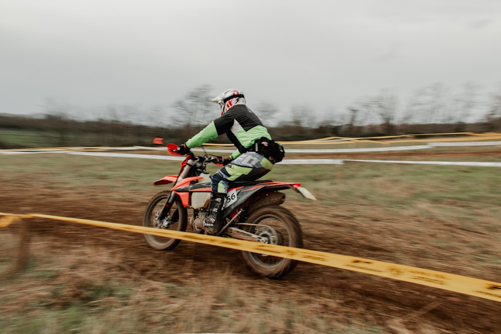 a person riding a dirt bike on a track