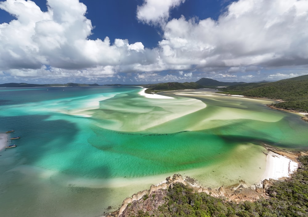 an aerial view of a body of water surrounded by land