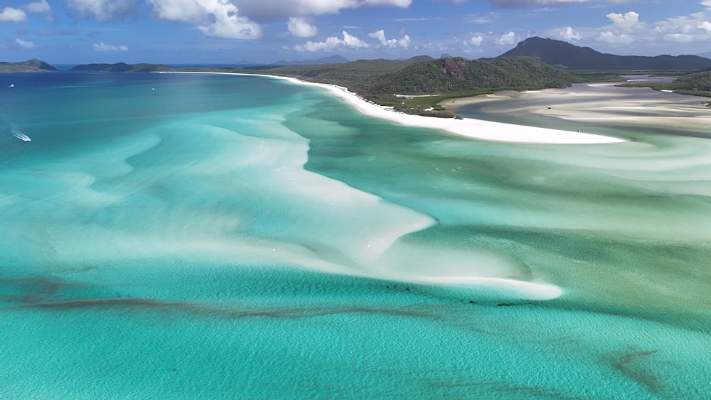 an aerial view of a beach and lagoon