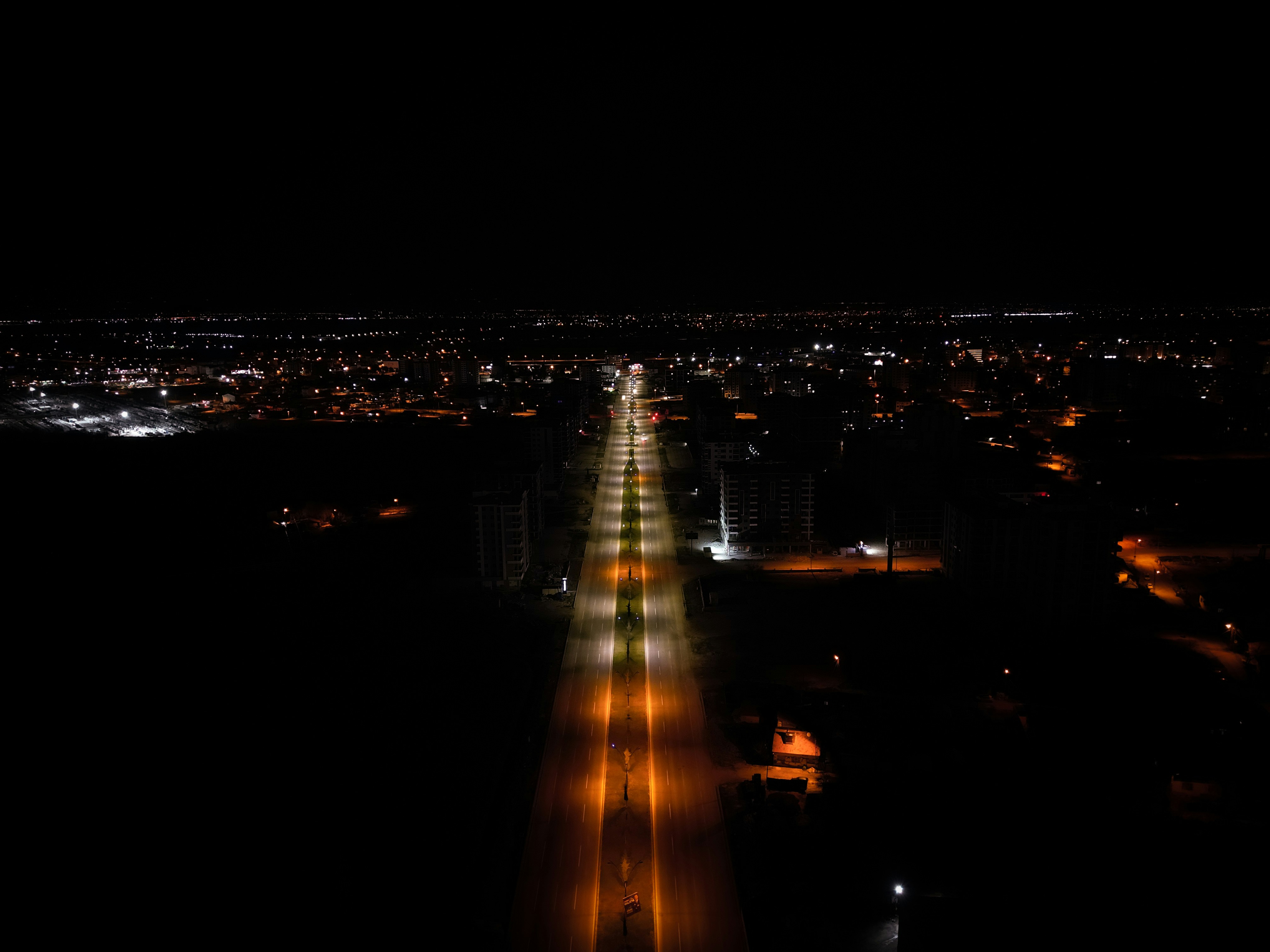 an aerial view of a city at night
