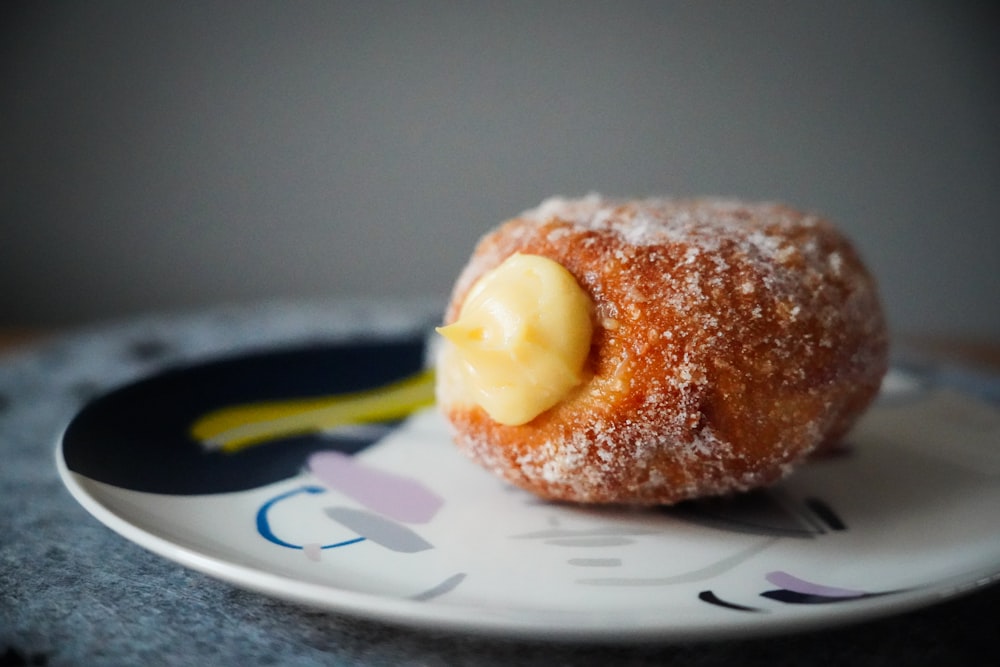 a powdered doughnut with a bite taken out of it