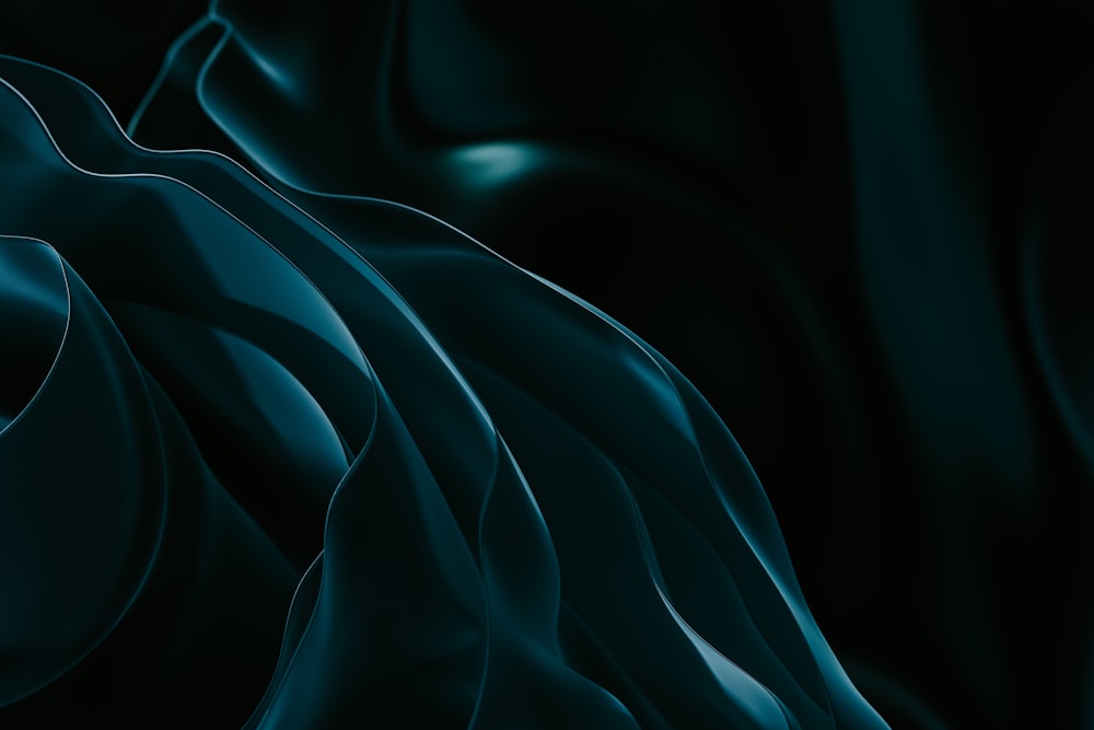 ein schwarz-blauer Hintergrund mit wellenförmigen Linien