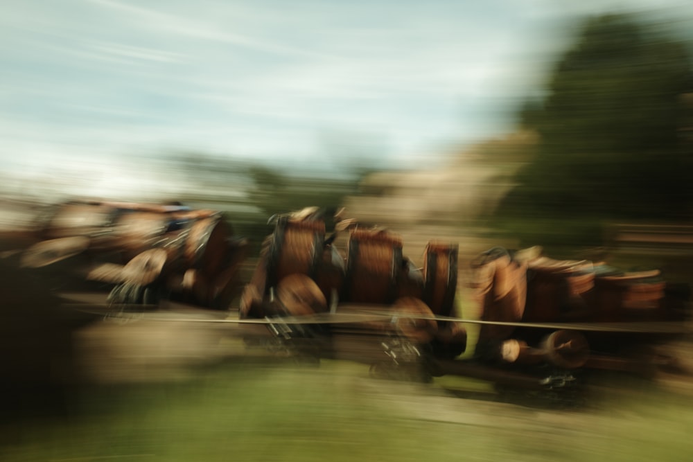 a blurry photo of a bunch of barrels