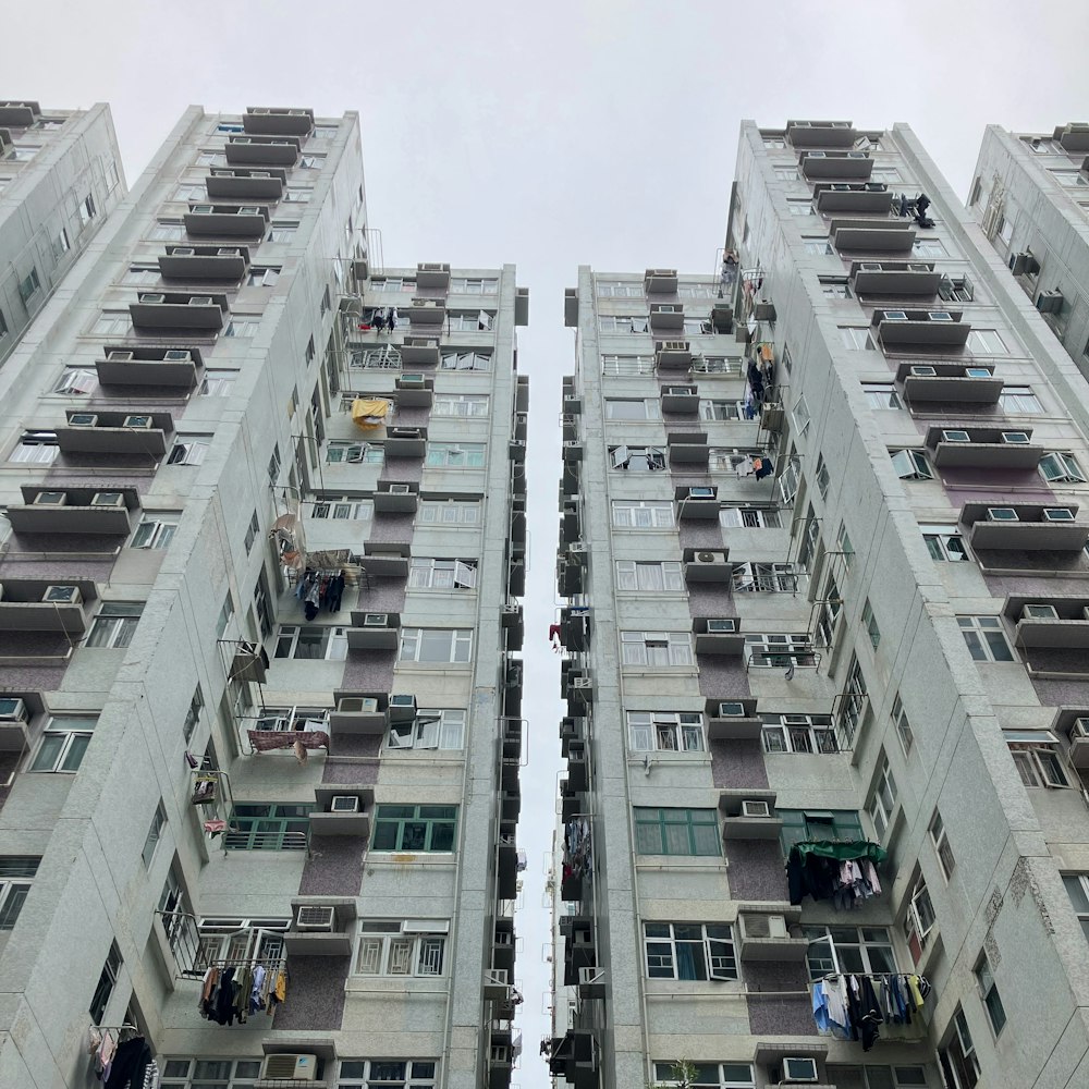 two tall buildings with balconies and balconies on them