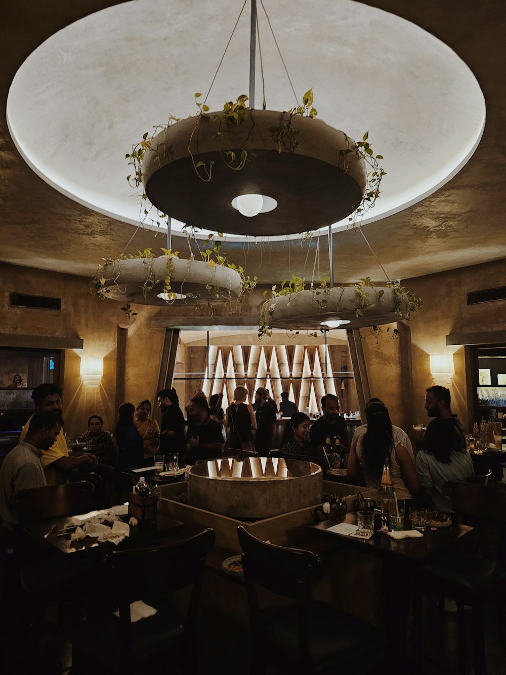 a group of people sitting at a table in a restaurant