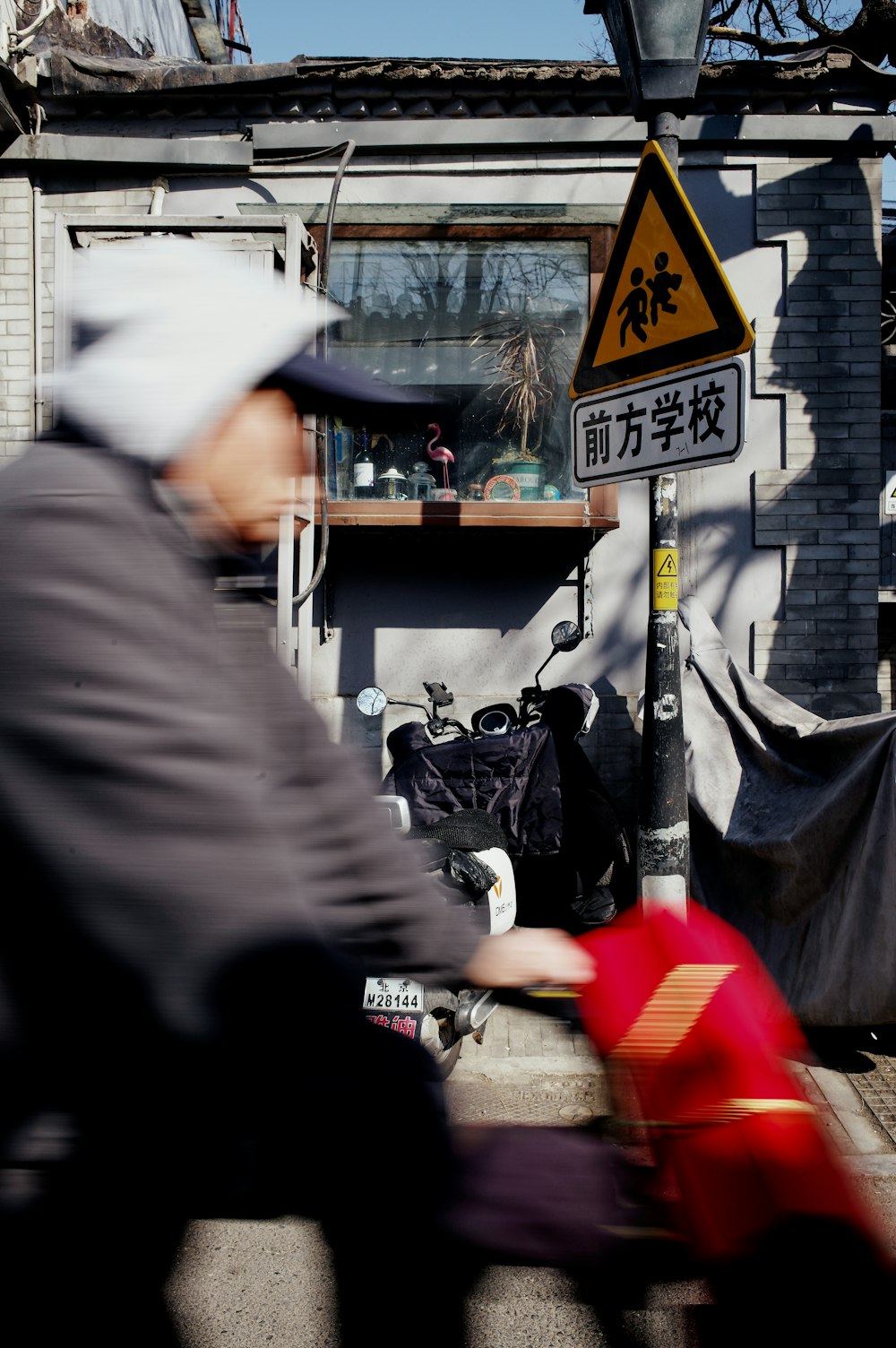 a man riding a motorcycle down a street