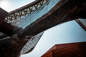 a close up of a building with a bridge in the background