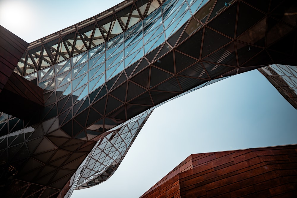 a close up of a building with a bridge in the background