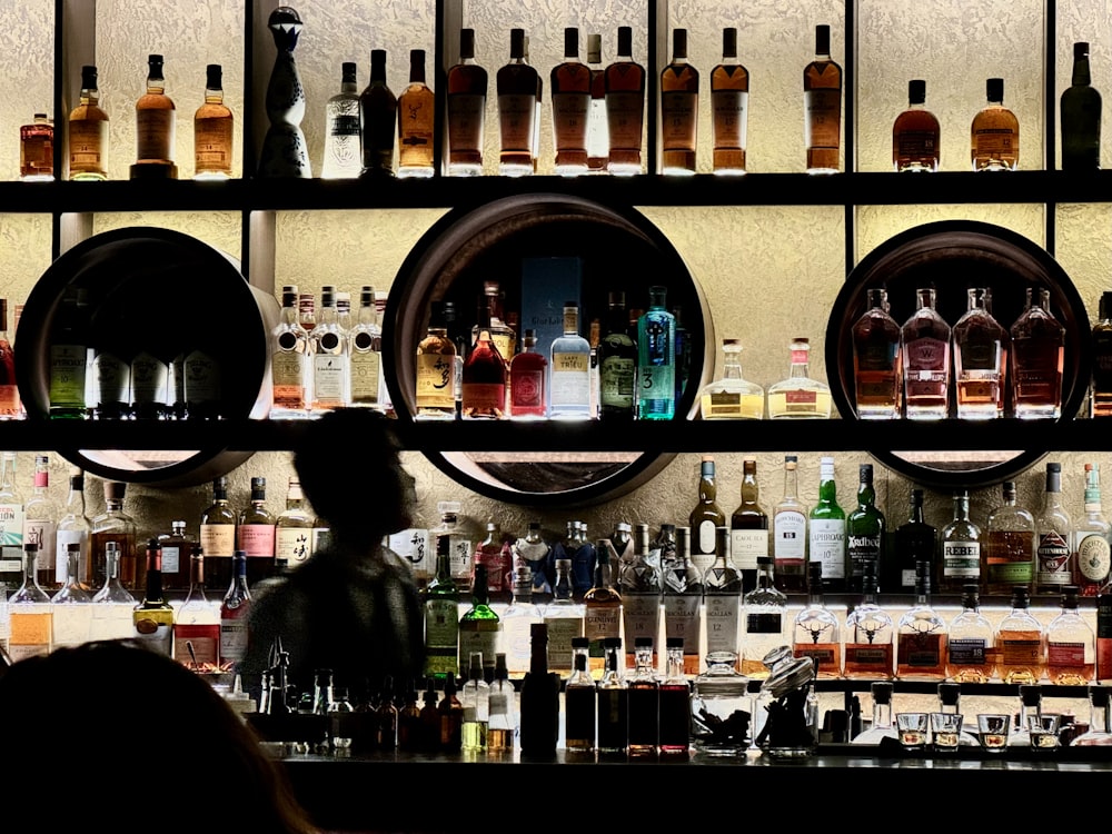 a bar filled with lots of bottles of liquor