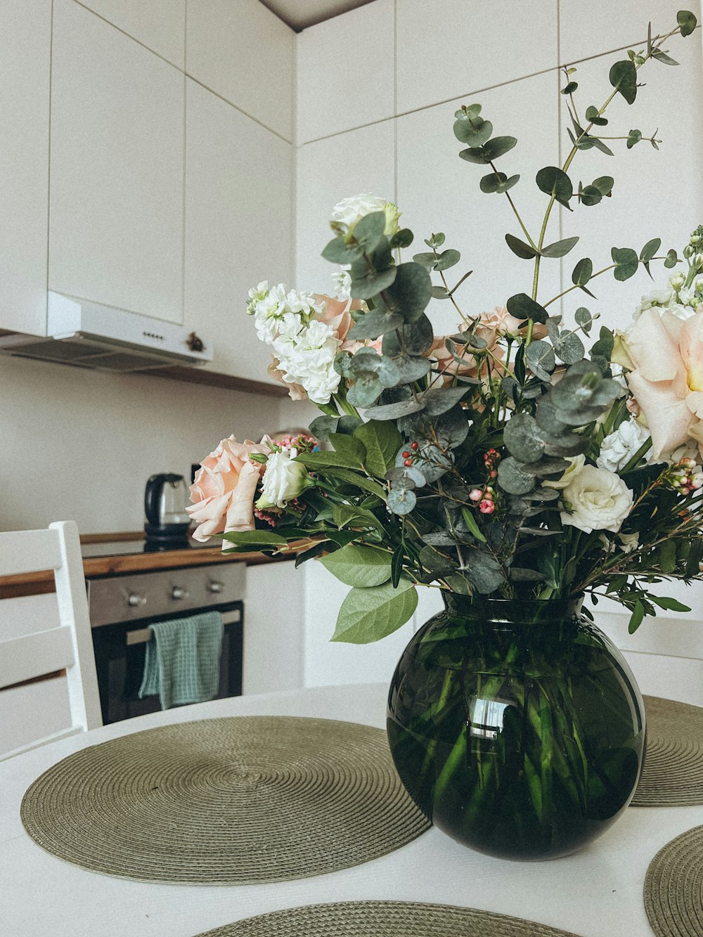 a vase filled with flowers on top of a table