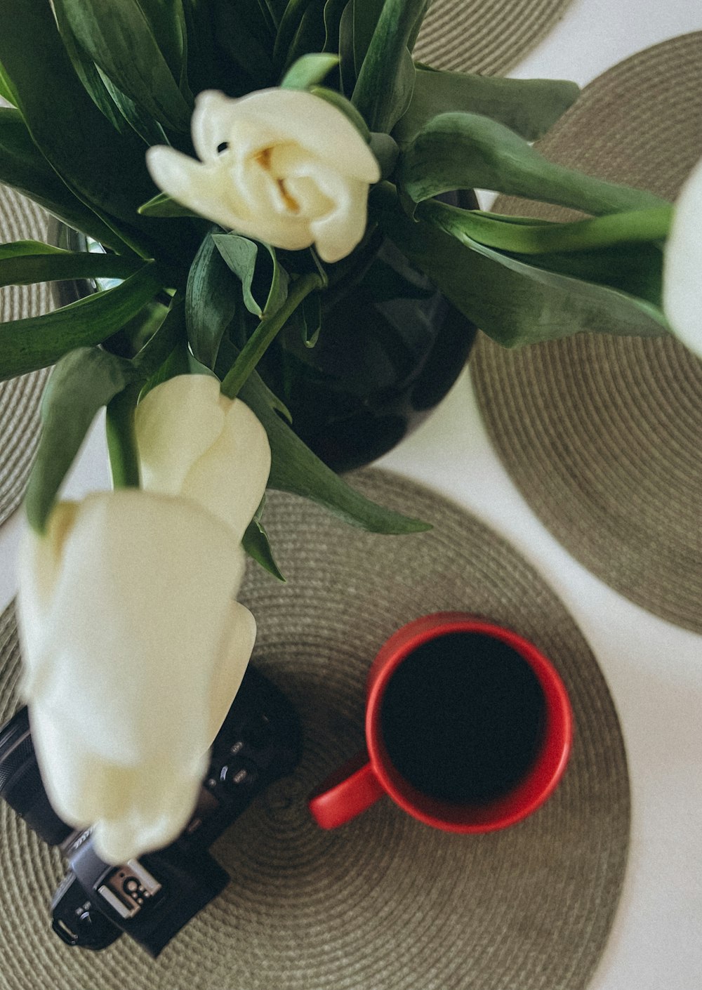 a close up of a plate with a cup of coffee