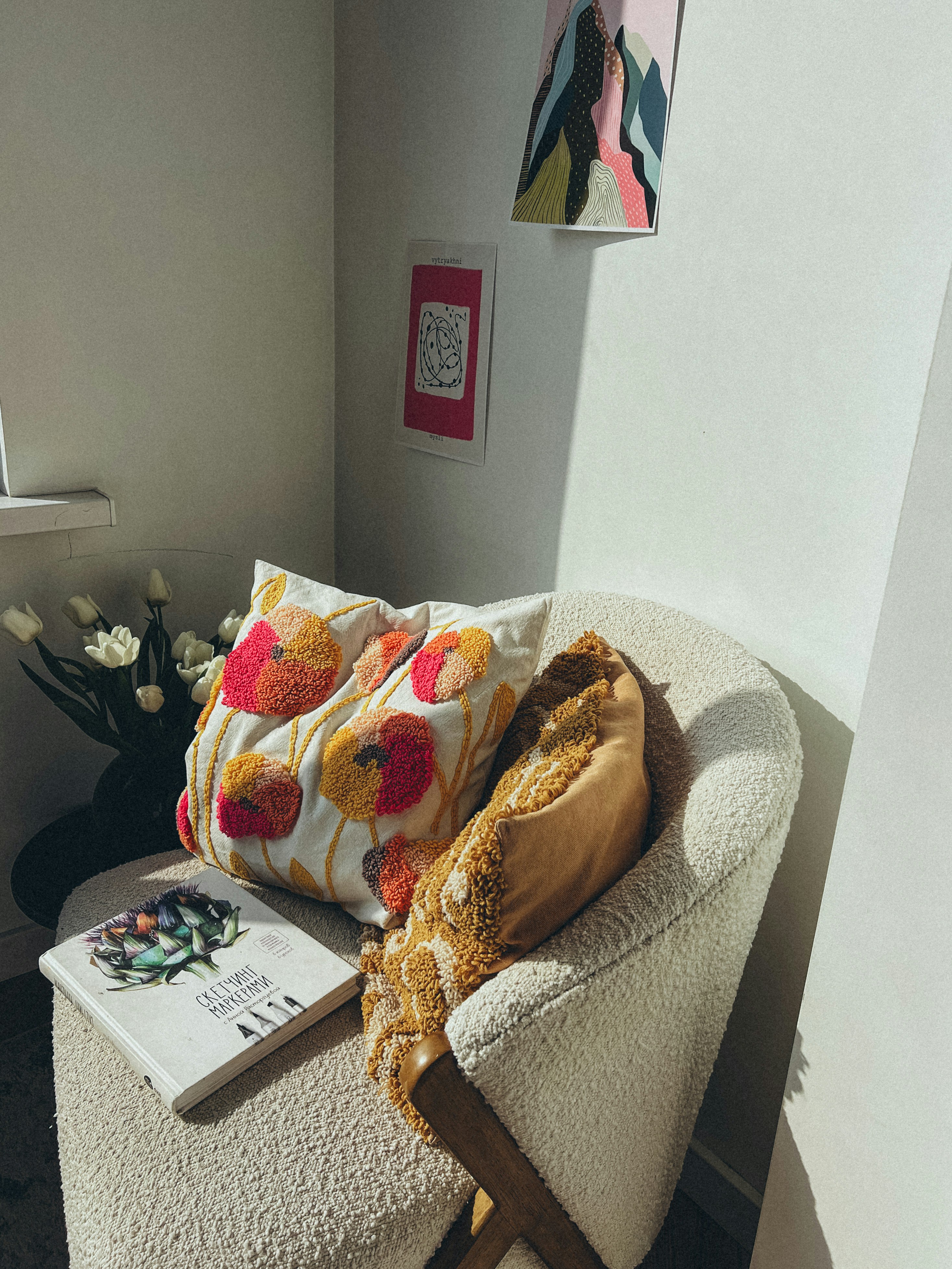 a chair with a pillow and a book on it