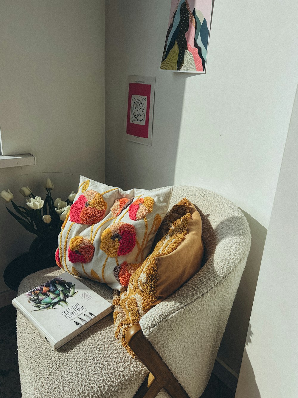 a chair with a pillow and a book on it