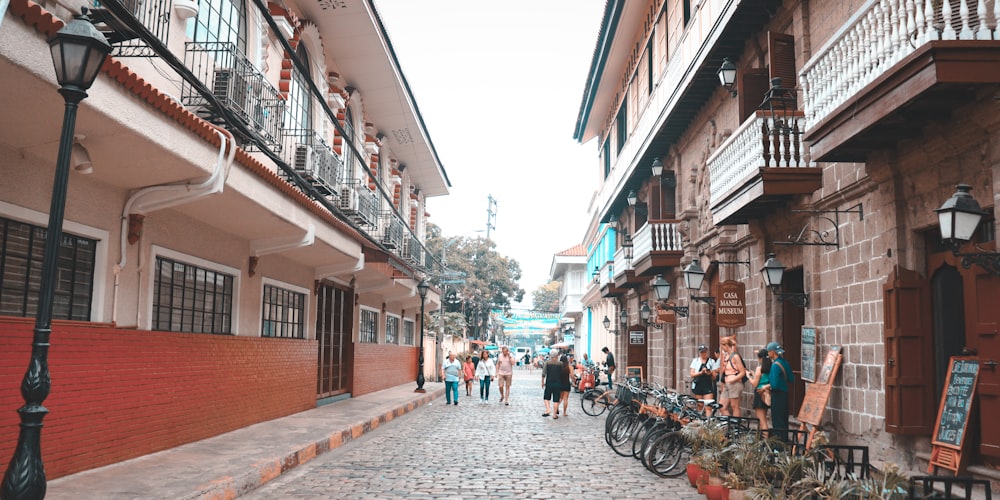 a cobblestone street lined with parked bicycles