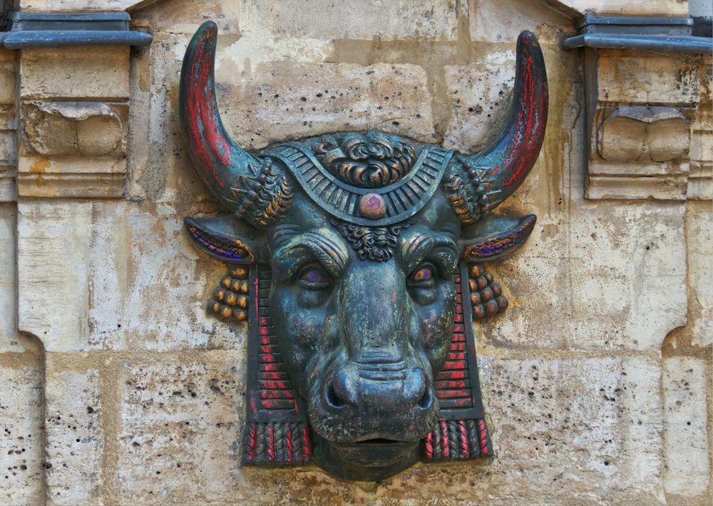 a bull's head on the side of a building