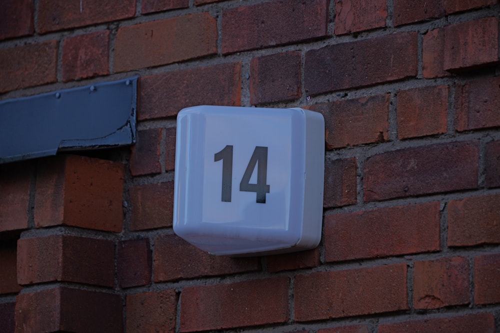 a close up of a brick wall with a clock on it