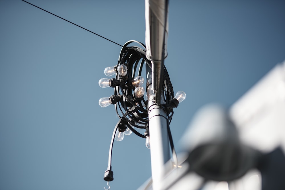 a bunch of lights that are on a pole