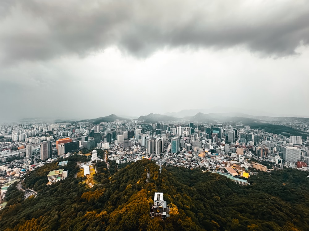 an aerial view of a city with tall buildings