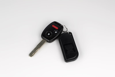 a car key with a remote control attached to it
