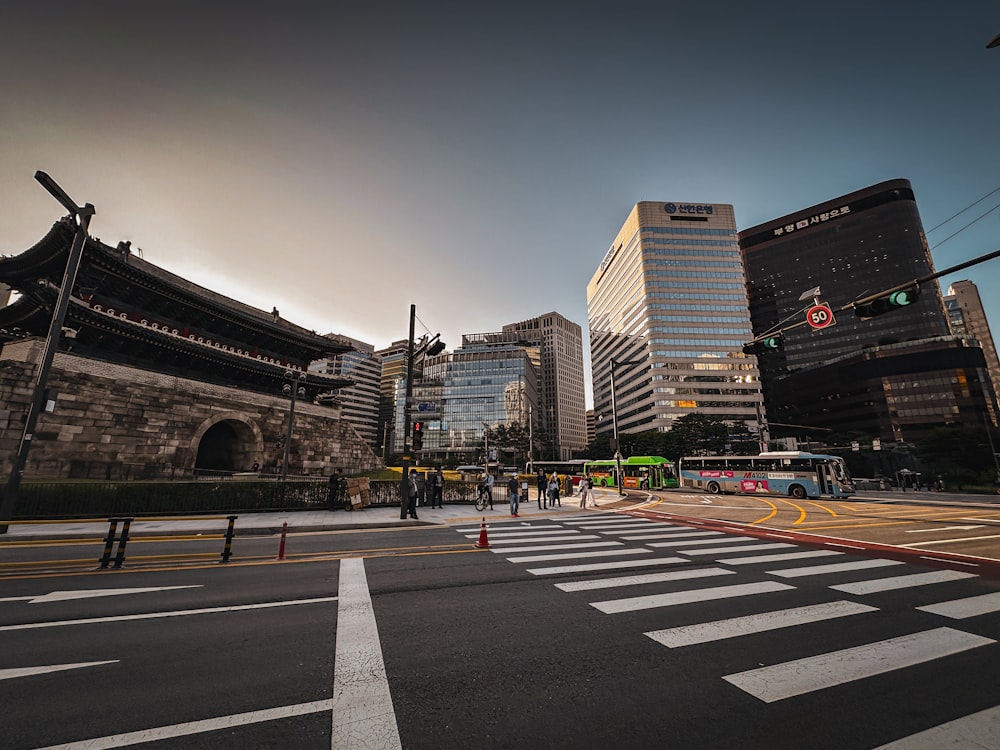 a city street filled with traffic and tall buildings