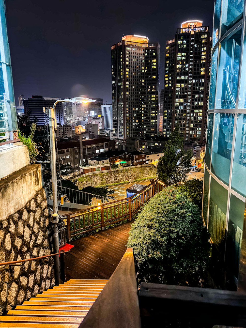 a night view of a city with tall buildings