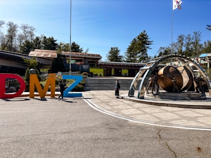 a man standing in front of a large metal object
