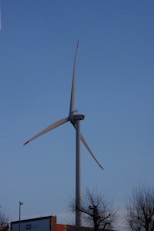 a large wind turbine on top of a building