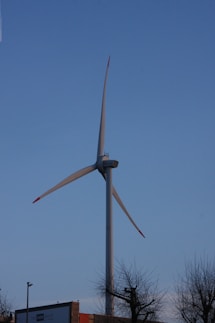 a large wind turbine on top of a building
