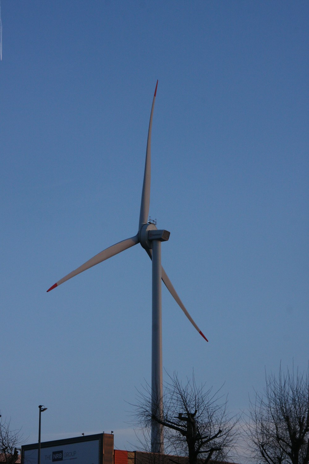a large wind turbine on top of a building