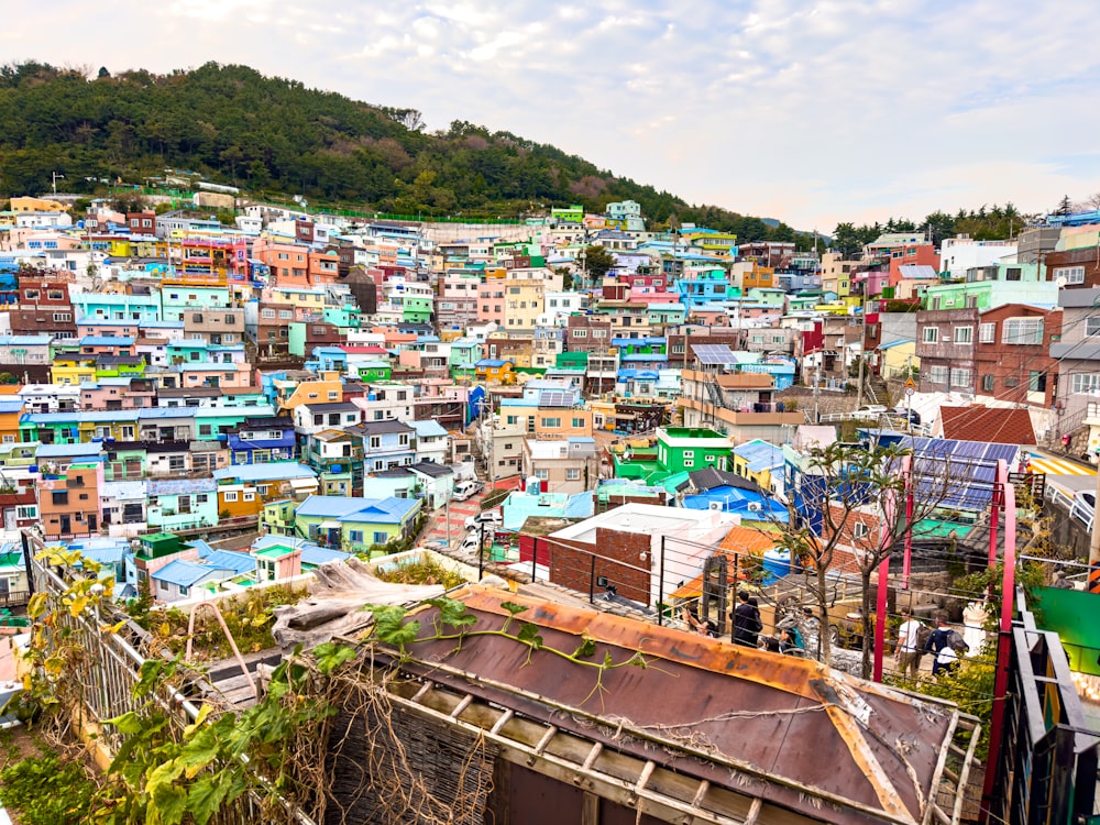 a large group of colorful buildings on a hill