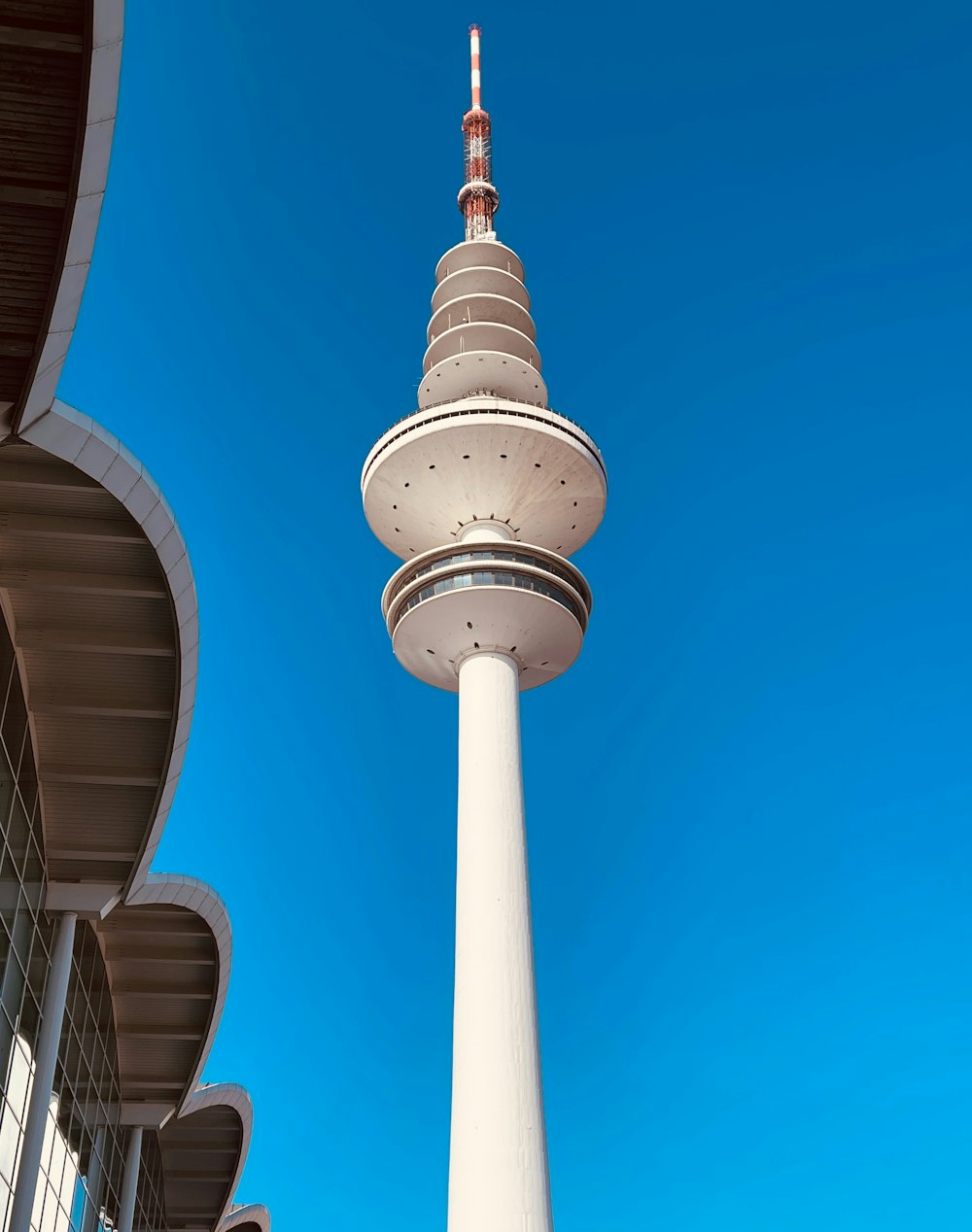 a tall white tower with a sky background