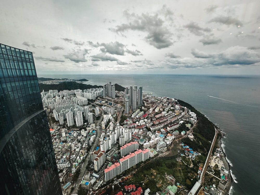 an aerial view of a city and a body of water