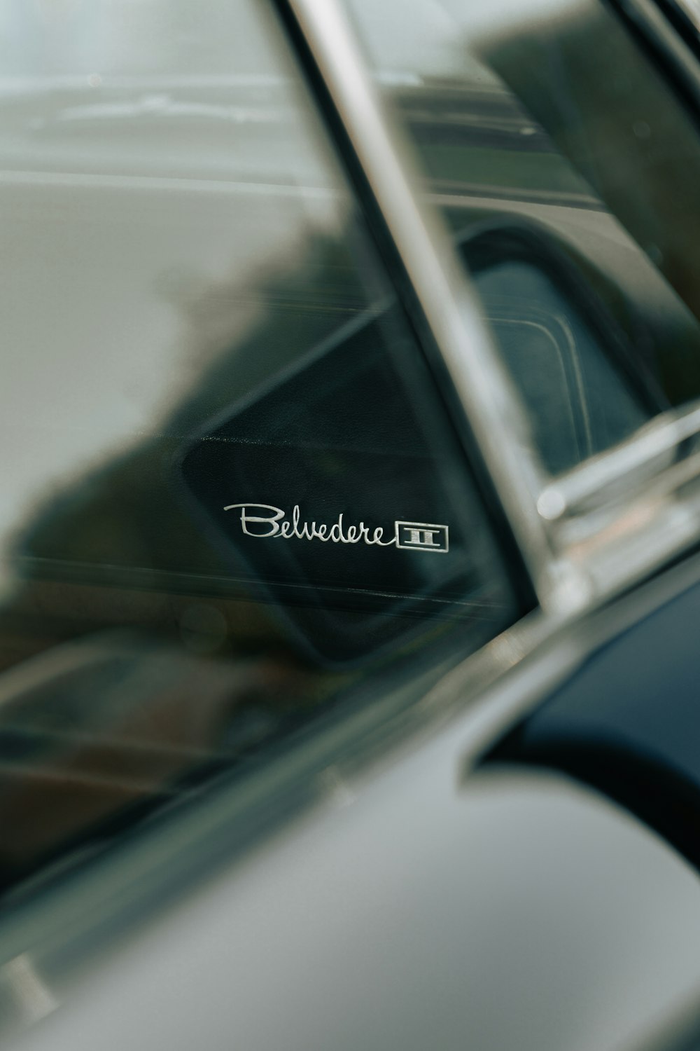 a close up of a car door with the word budder on it