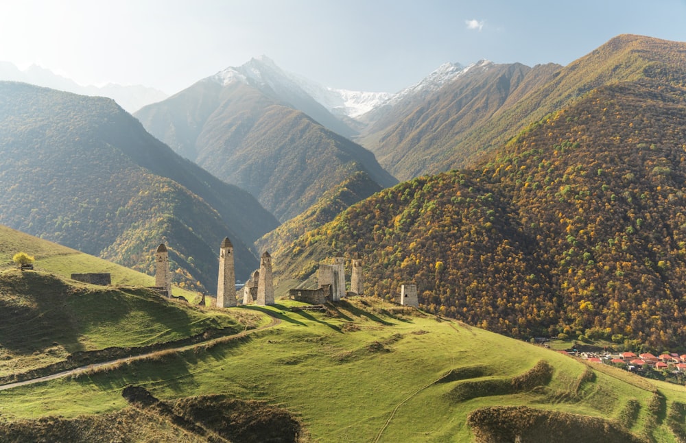 a scenic view of a mountain range with a church in the foreground