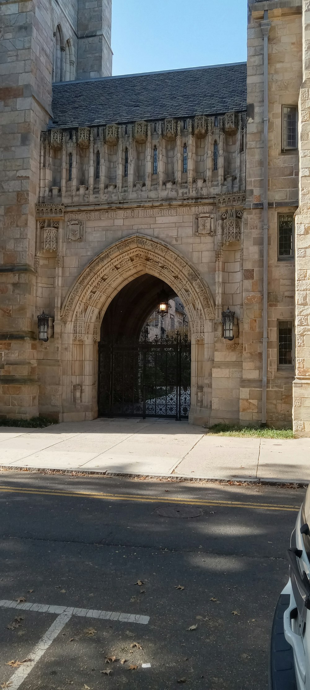 a car parked in front of a stone building