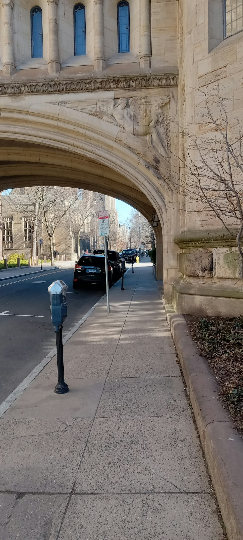 a parking meter sitting on the side of a road