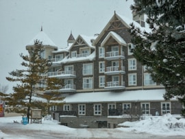 a large building with a lot of windows in the snow