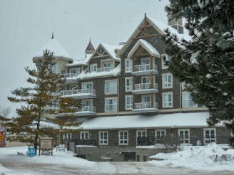 a large building with a lot of windows in the snow