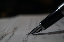 a pen is sitting on top of a piece of paper