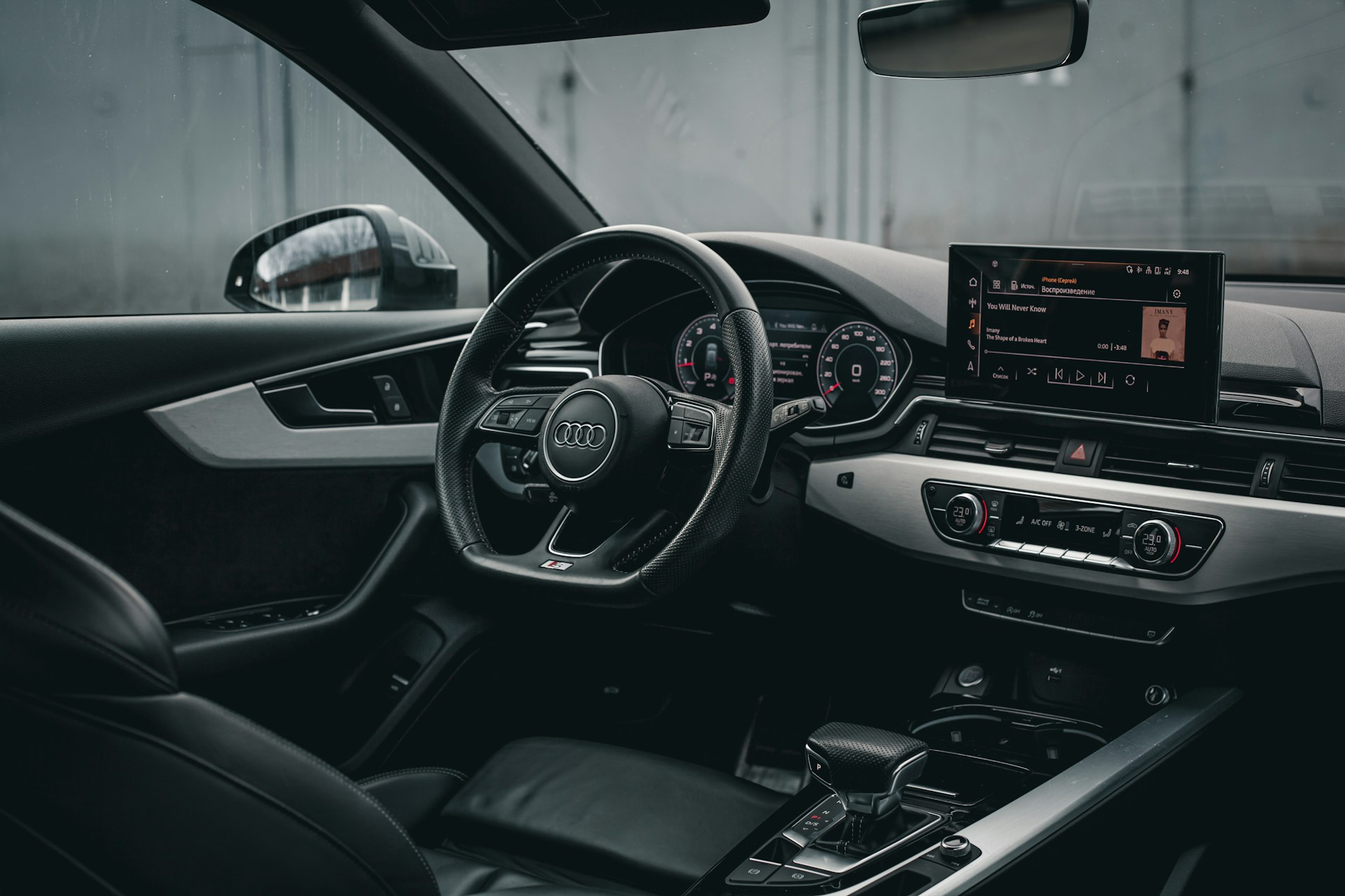 the interior of a car with a steering wheel and dashboard
