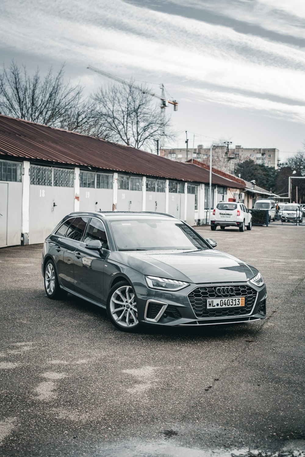 a grey car parked in a parking lot