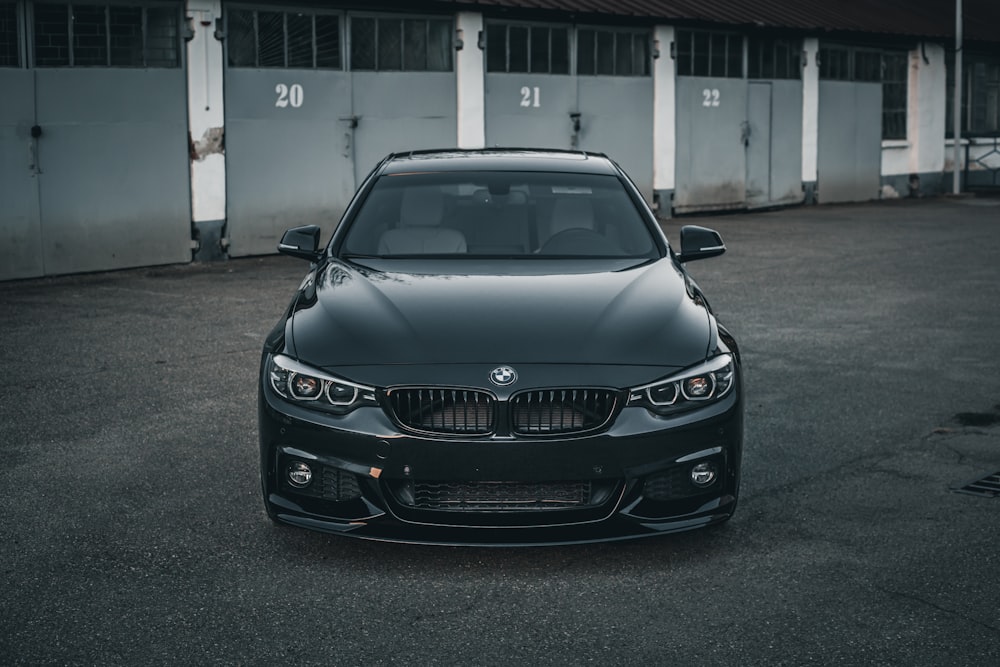 a black car parked in a parking lot